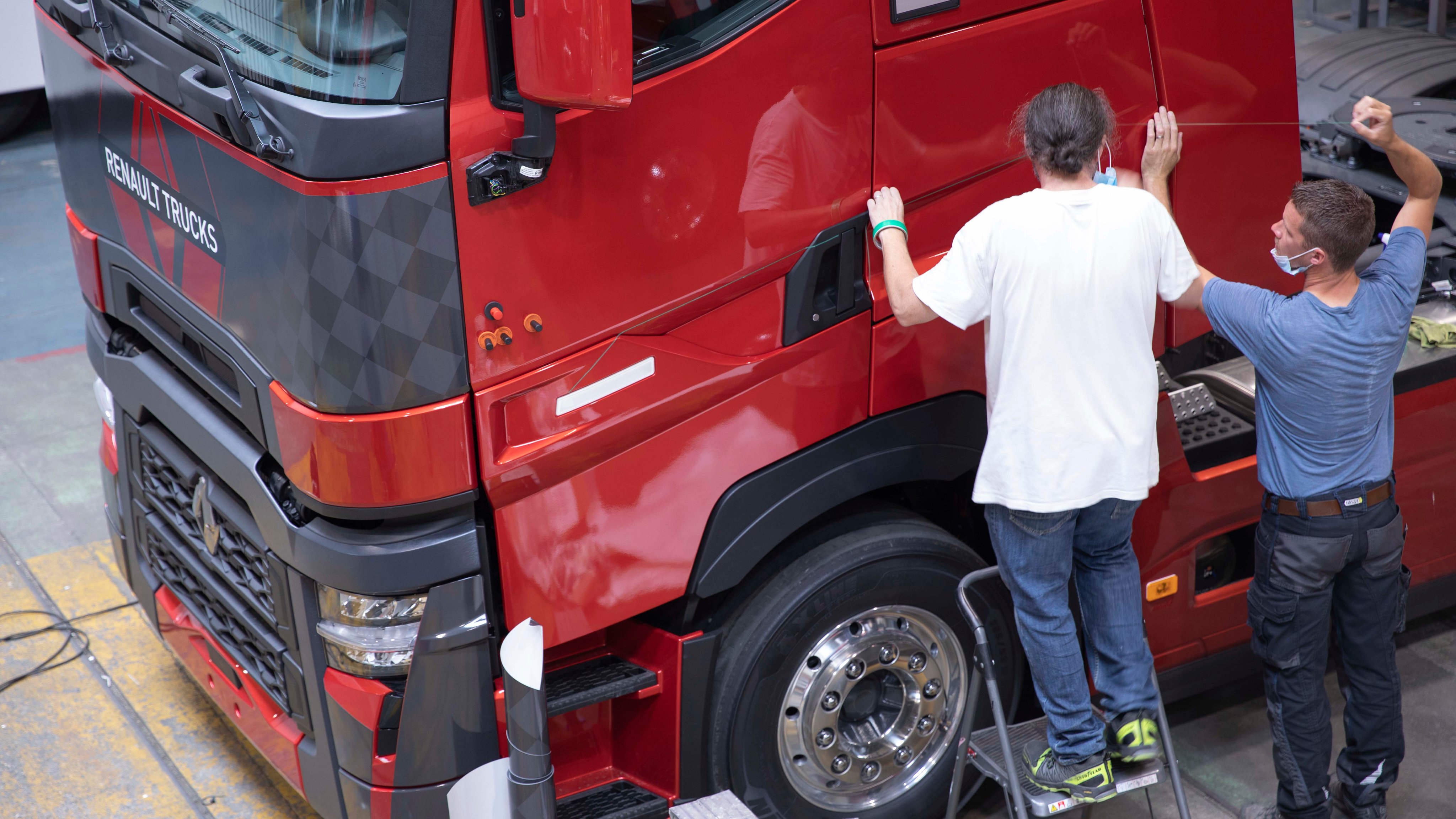 Applying the livery to the real truck at the Renault factory